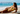Woman in yellow bikini lying on a beach with 'Hello Summer! Sale Up To -70%' text overlay.